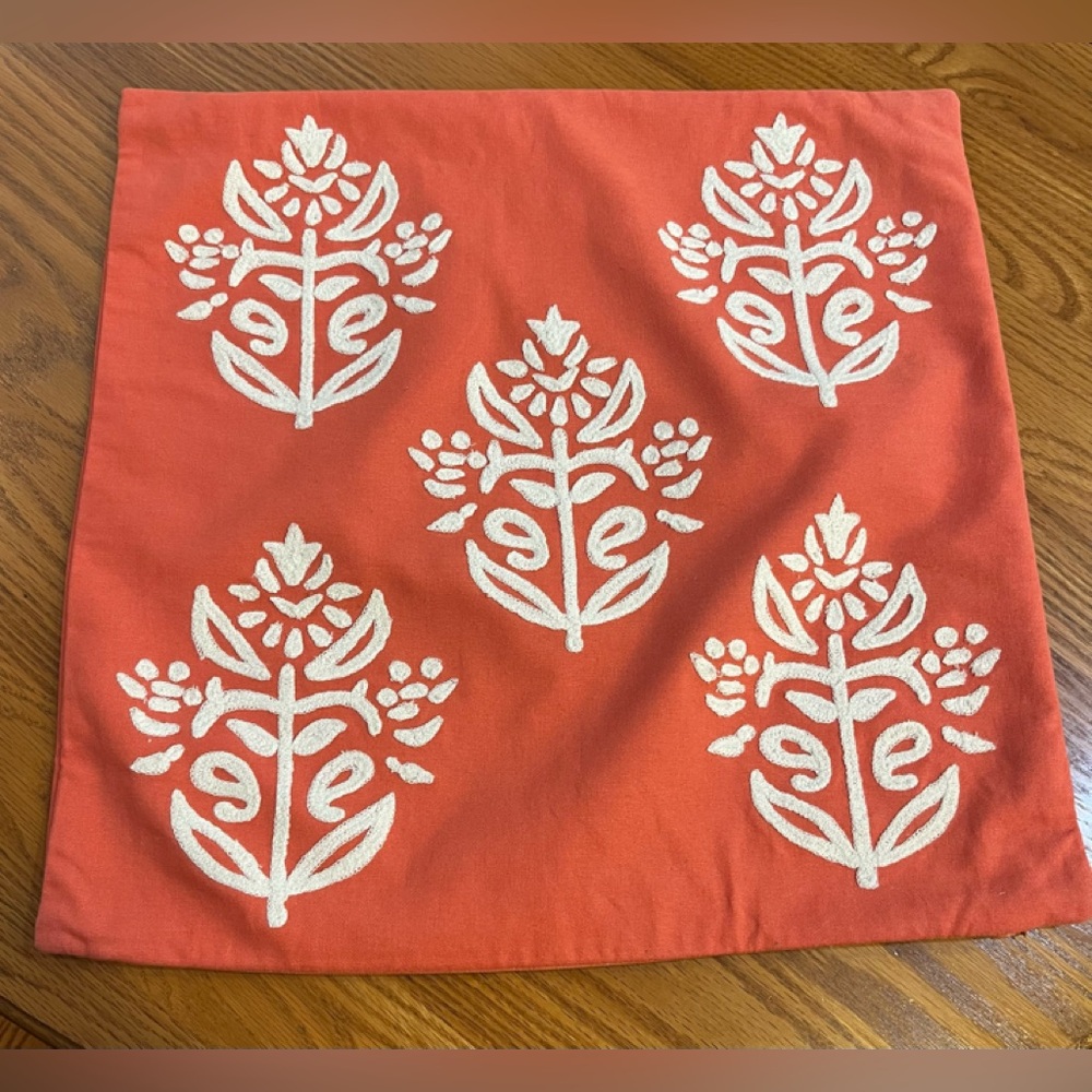 Pottery Barn Kyla Coral Zippered Pillow Cover with White Embroidery Detail.